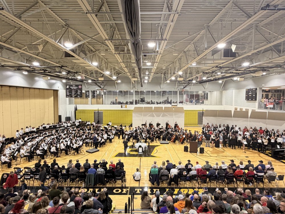 Band, Choir, and Orchestra performing on the gym floor at our Veteran's Day celebration