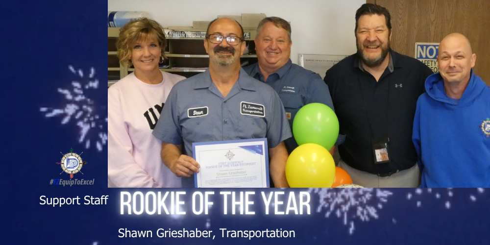 Grieshaber with certificate, flanked by administrators