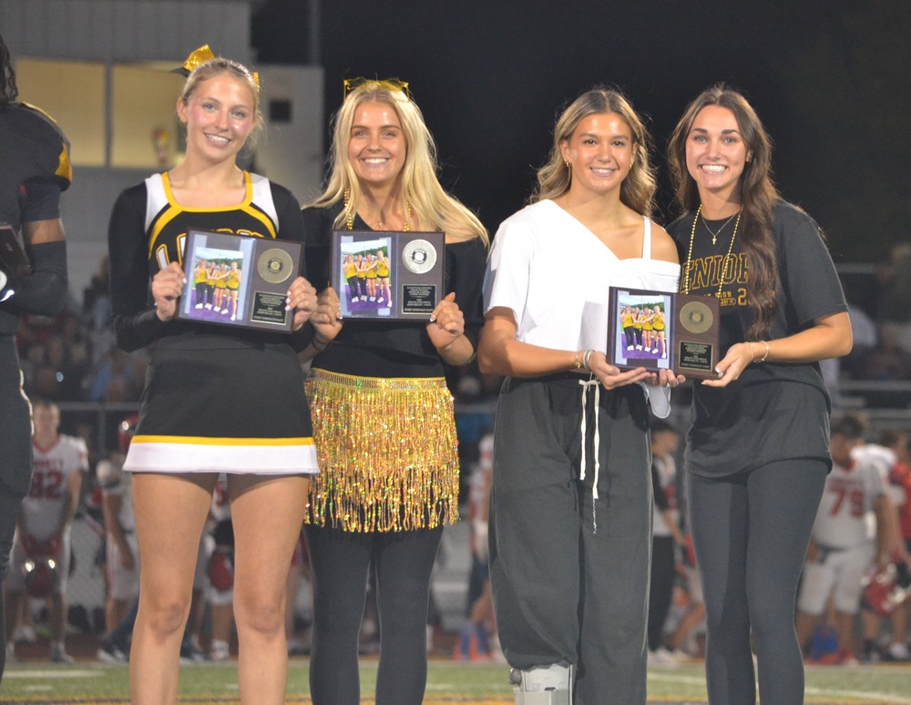Savannah Oxford, Celia Staley, Natalie Carter, and Avery Foster Posing at half field