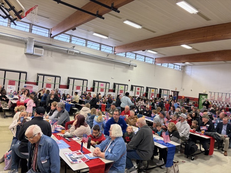 LCE SPE Vets Day Crowd - students and parents and guests in red white and blue.