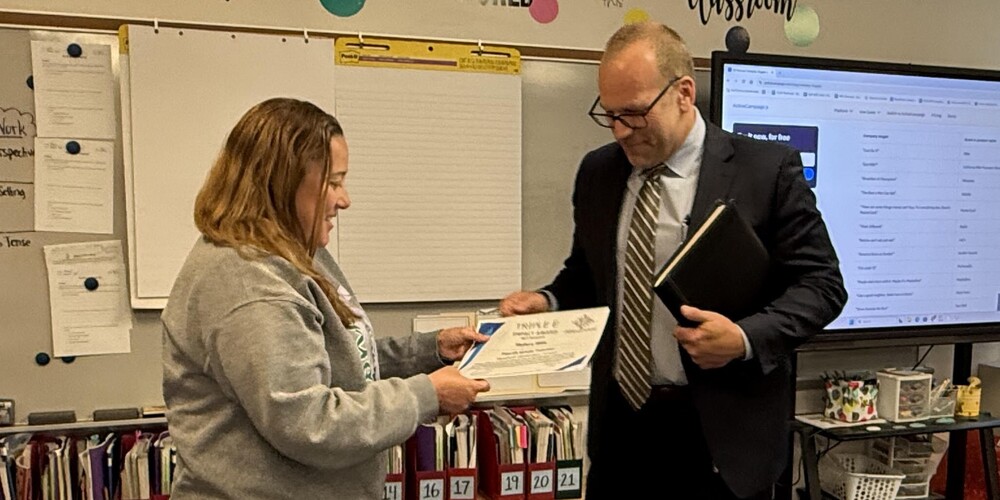 Superintendent surprises teacher with EEE certificate