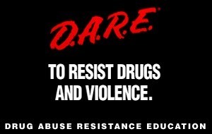 DARE LOGO- the word DARE in red handwritten script on a black field