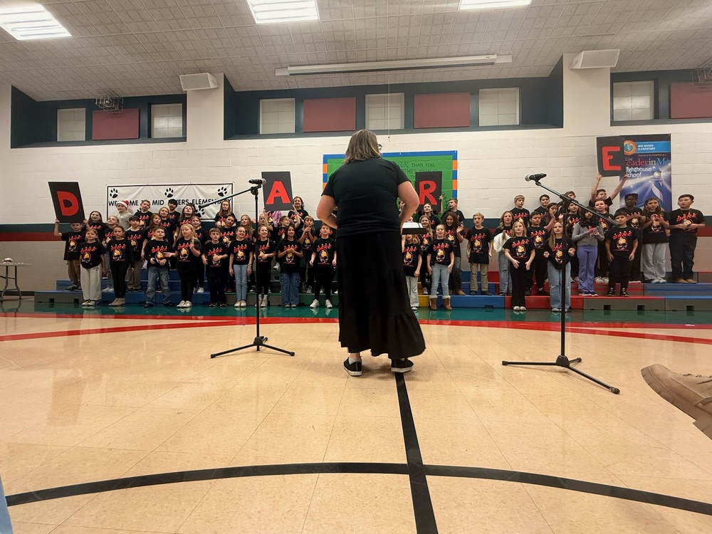 Mrs. Cummins leading the chior in the DARE song.