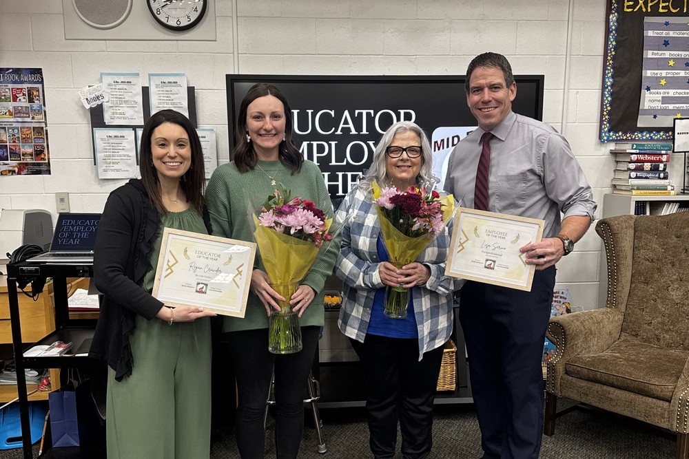 Dr. Romanchuk and Mr. Musgrove posing with Mrs. Crowder and Mrs. Serino