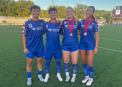 Owen Podmore, Jacob Phillips, Lily Steinmetz, and Maya Gaines posing for a post game picture