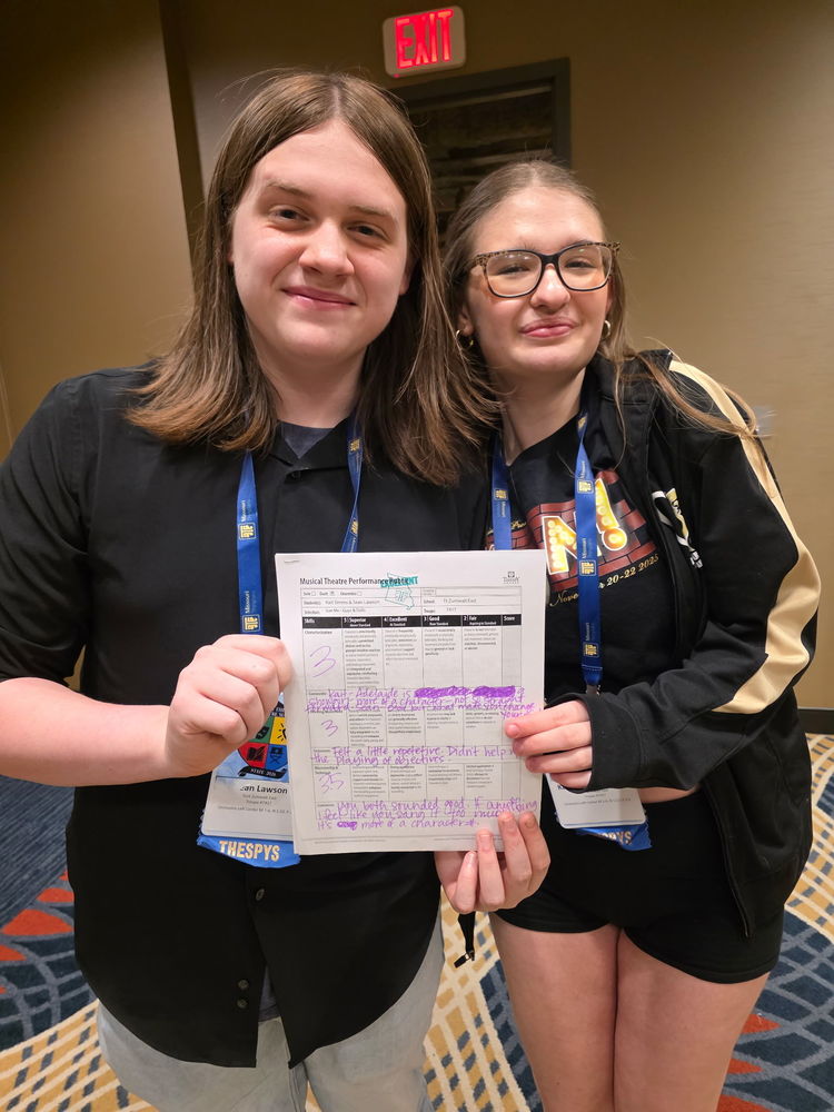 Sean Lawson and Kait Simms holding certificate together