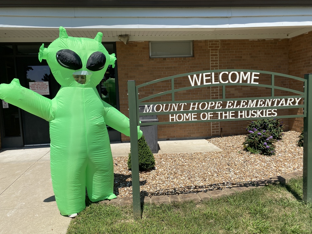 green alien at Mount Hope welcome sign