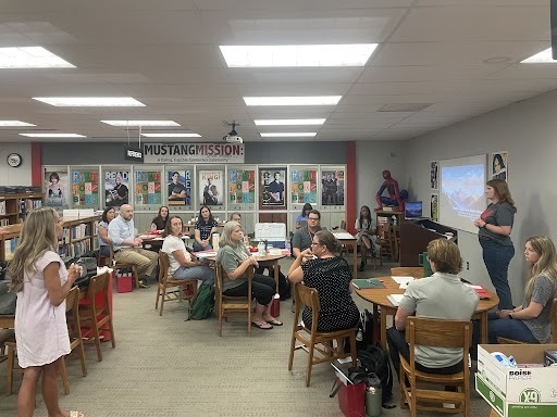 New teachers listening to Mrs. Deterding present