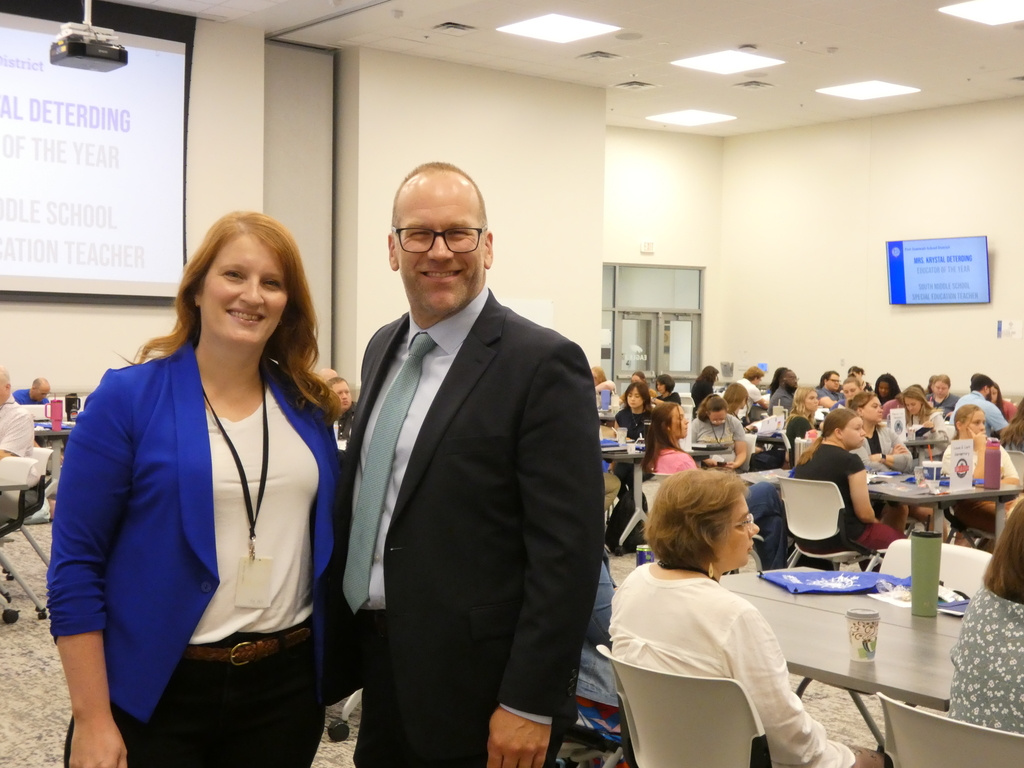 Educator of the Year and Superintendent stop for a picture at New Educator Welcome