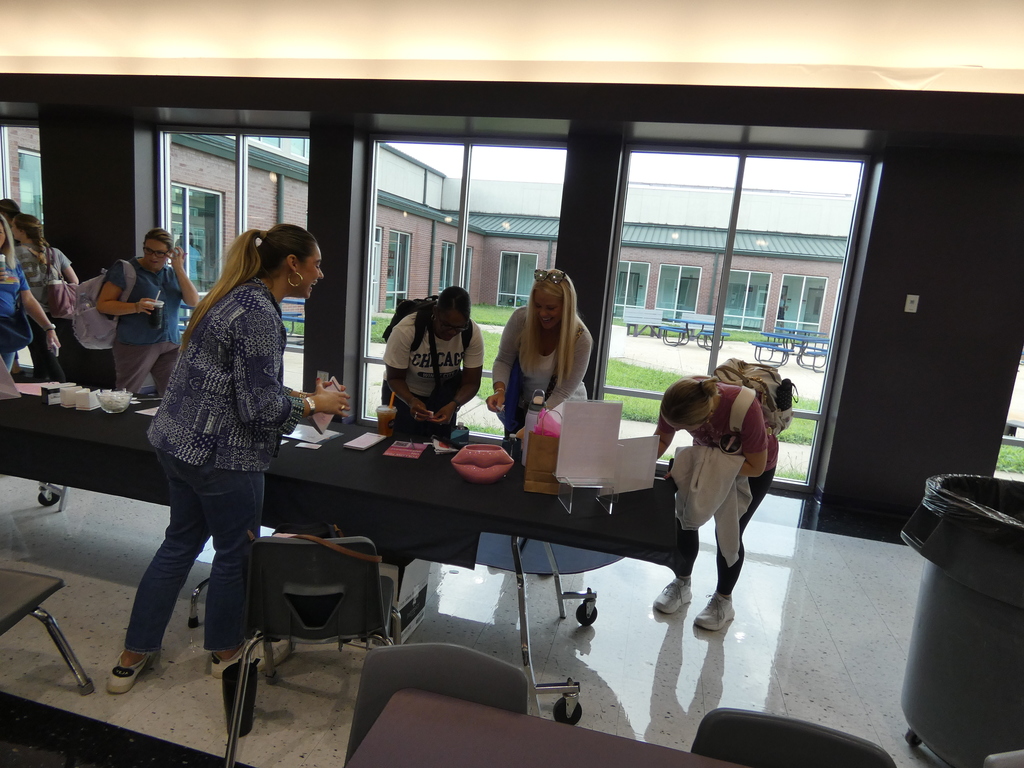 Business leaders greet teachers in the foyer