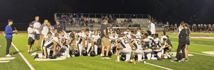 The football team meeting after the game