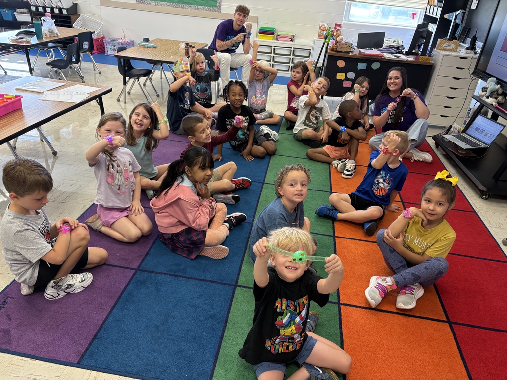 Showing off our new green bracelets from our classmate