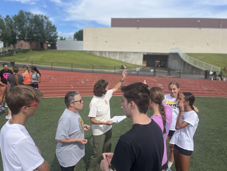 Coach Putnam and Coach Lowrey planning a run path for our Lions