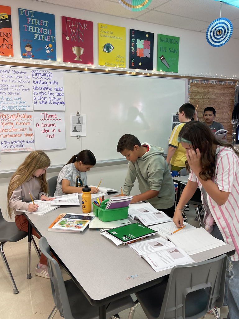 Fifth graders working collaboratively in a group.