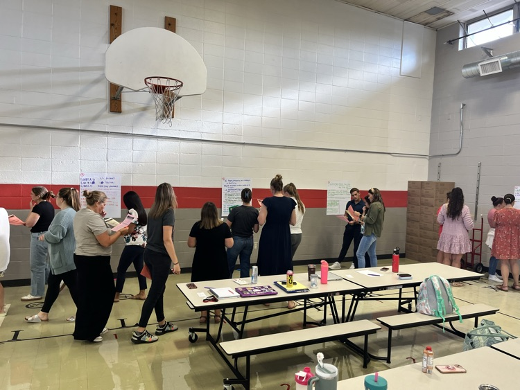 teachers meeting and discussing math standards