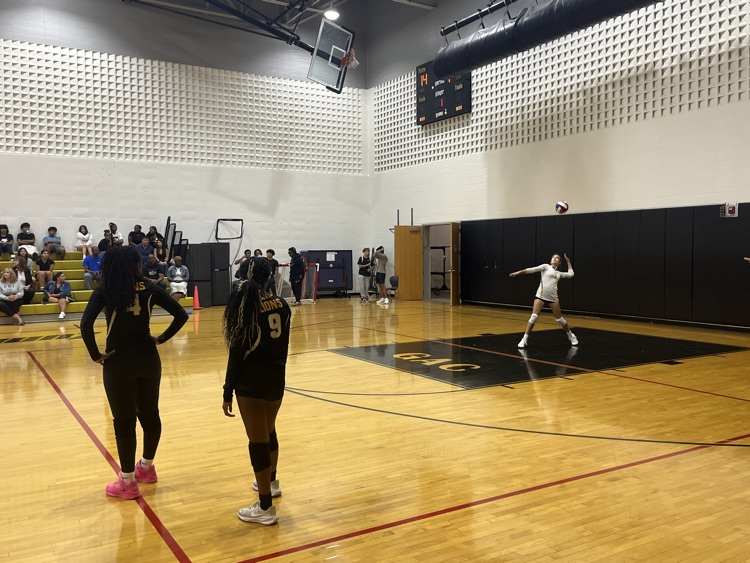C team serving to the Warriors