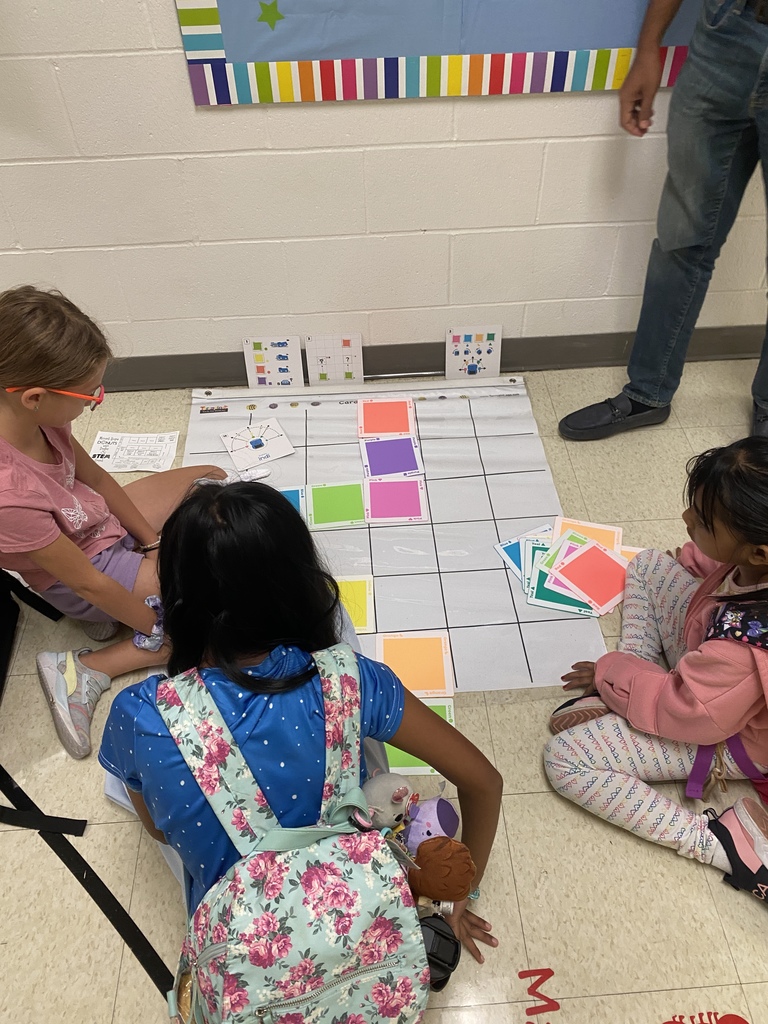 Students working together to create a path for Indi