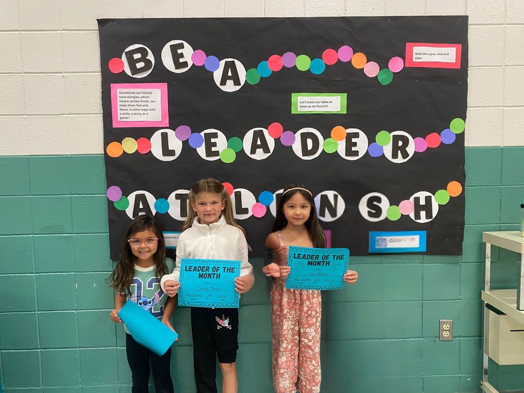 1st Grade Students with their Leader of the Class Awards