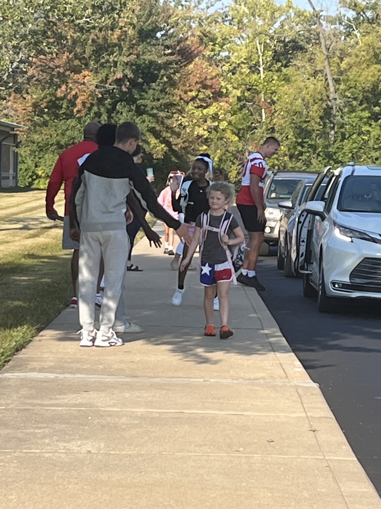 High fives on the way into school