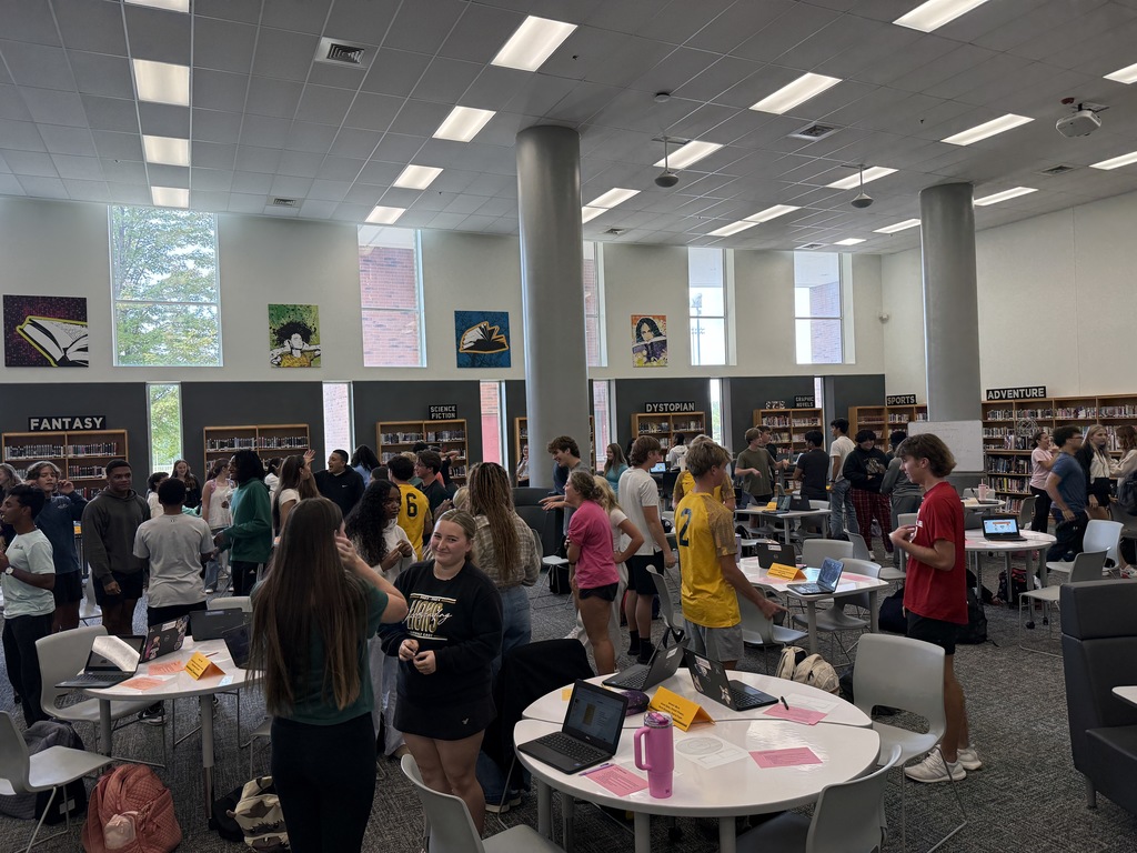 PPI students in the library participating in an icebreaker activity.