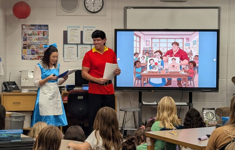 Belle and Gaston Reading at Mid Rivers Literacy Night
