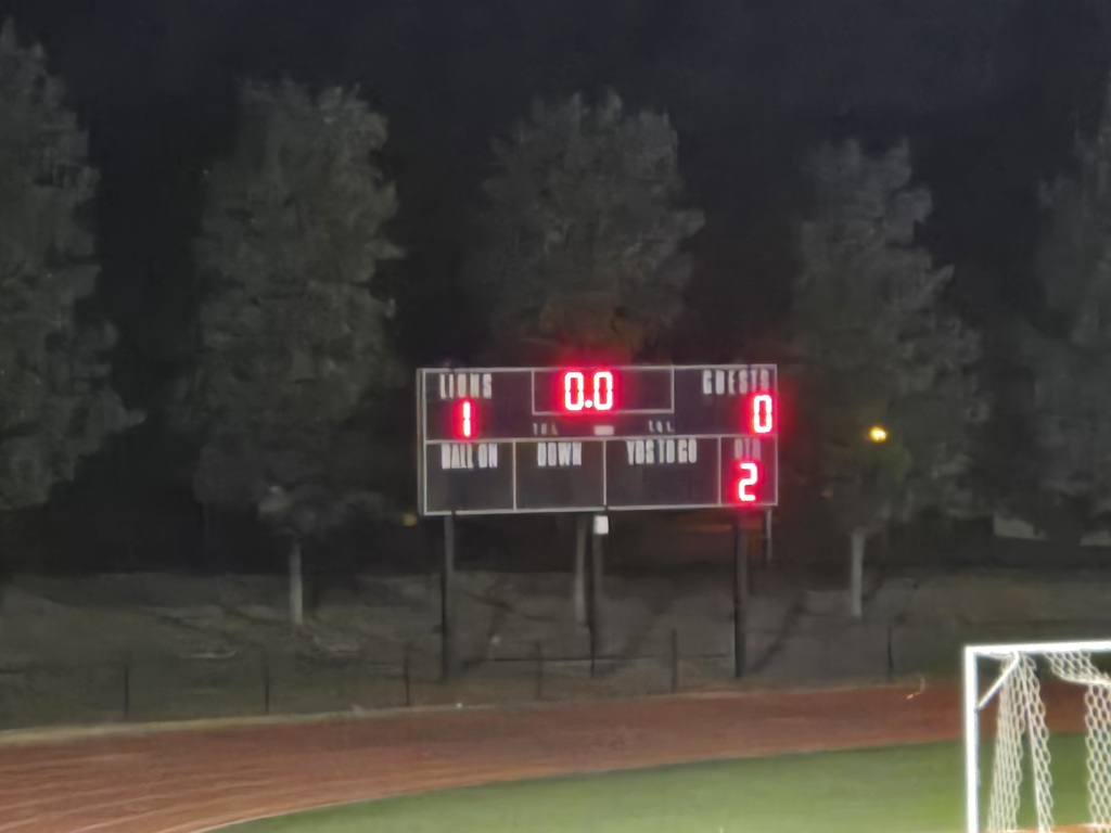 Scoreboard showing a 1-0 victory 