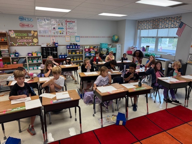 2nd graders trying olives after learning about Ancient Greece