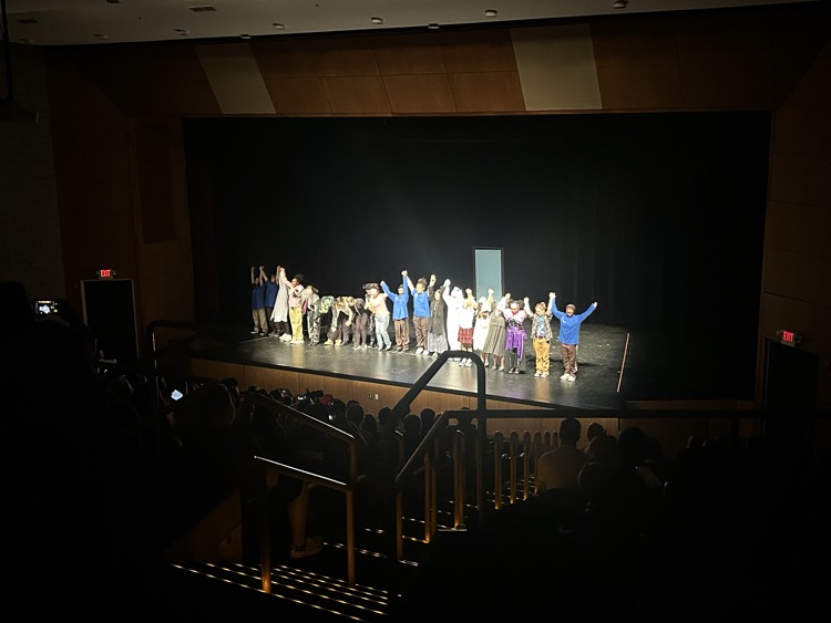 cast taking a bow at the conclusion of the show