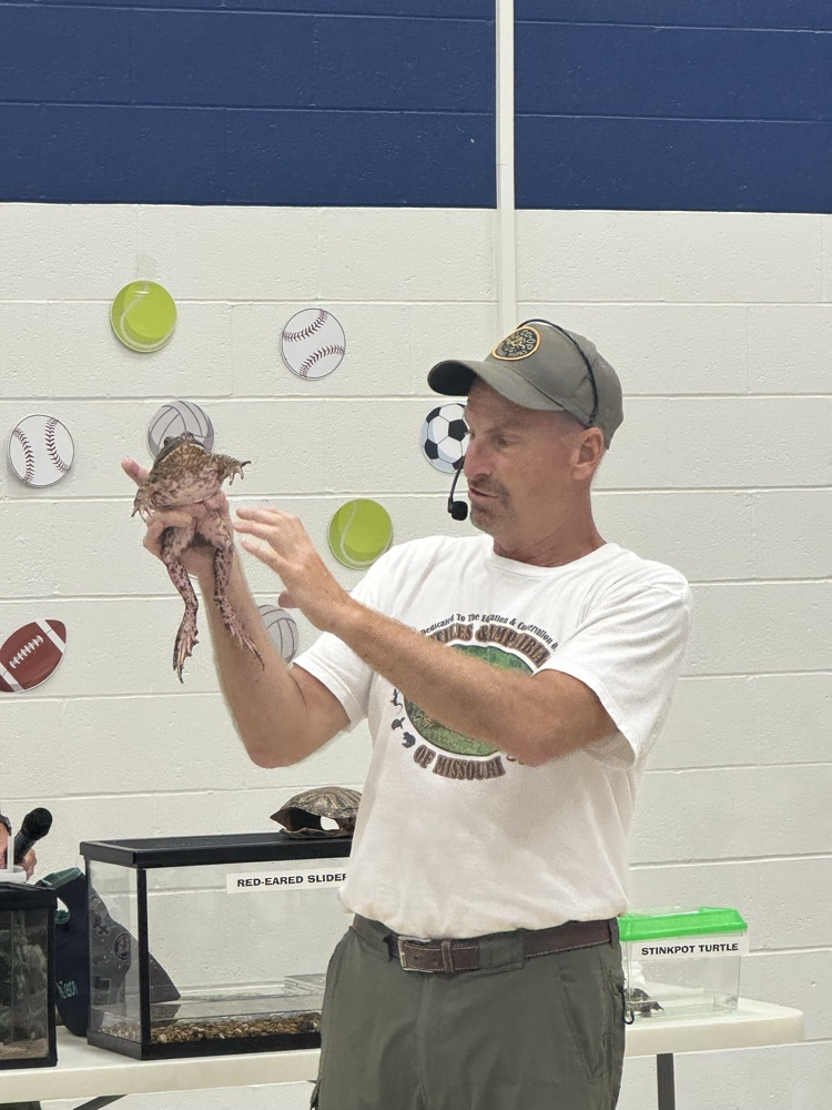 Man holding bullfrog 