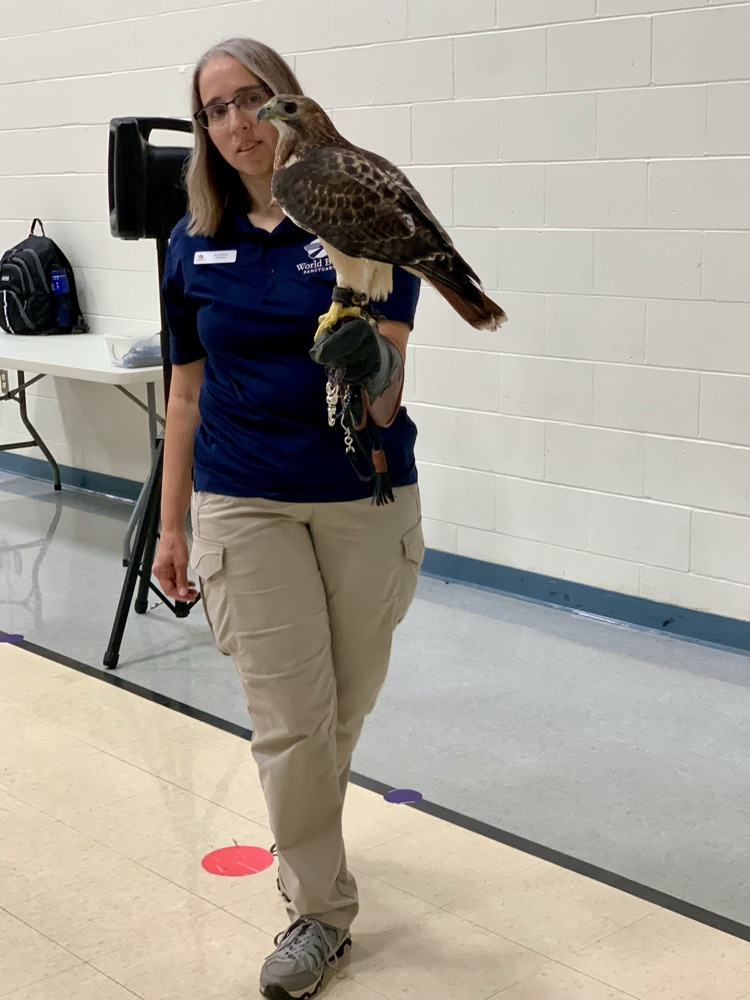 Woman holding bird of prey 