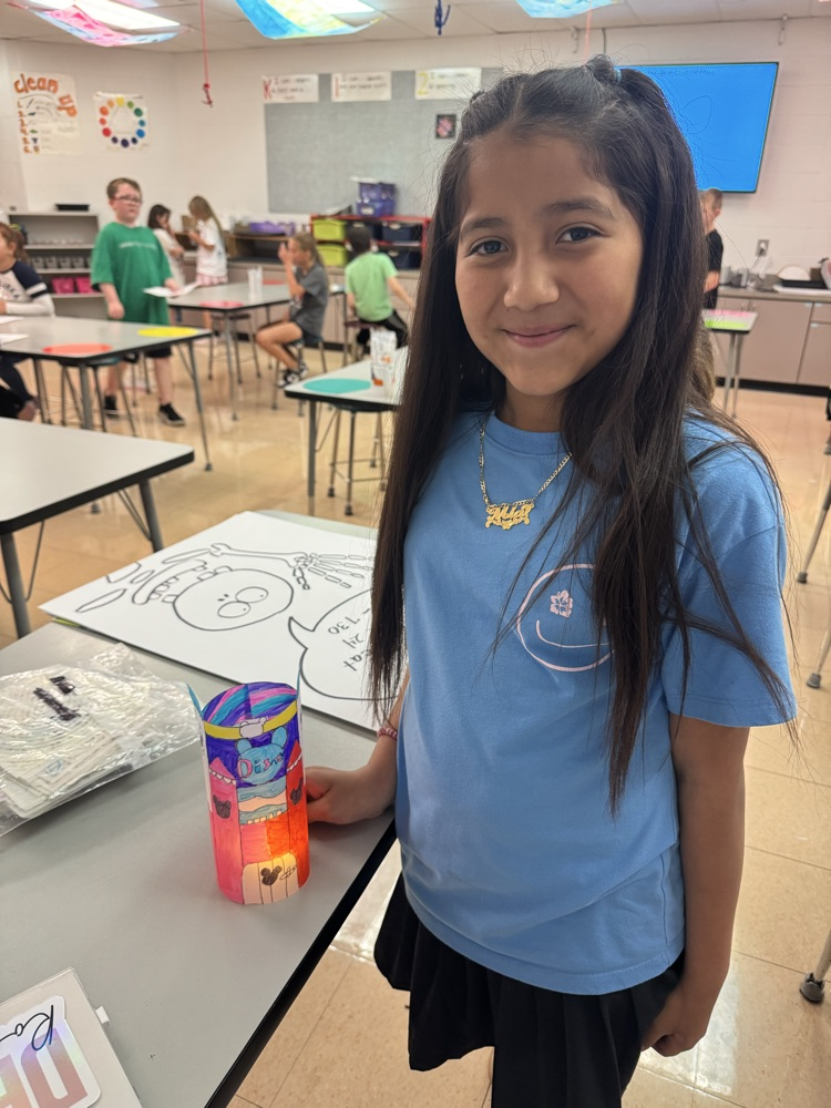 a fourth grader posing with their night light