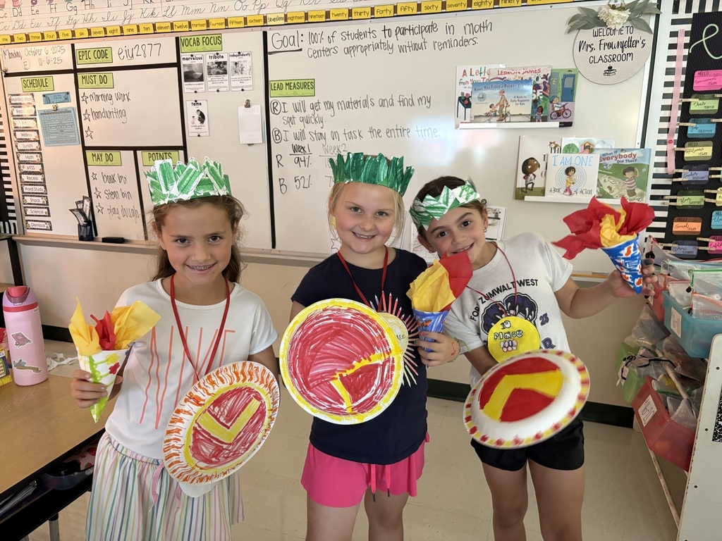 2nd grade students display their Spartan shields, Olympic torches and Crowns.