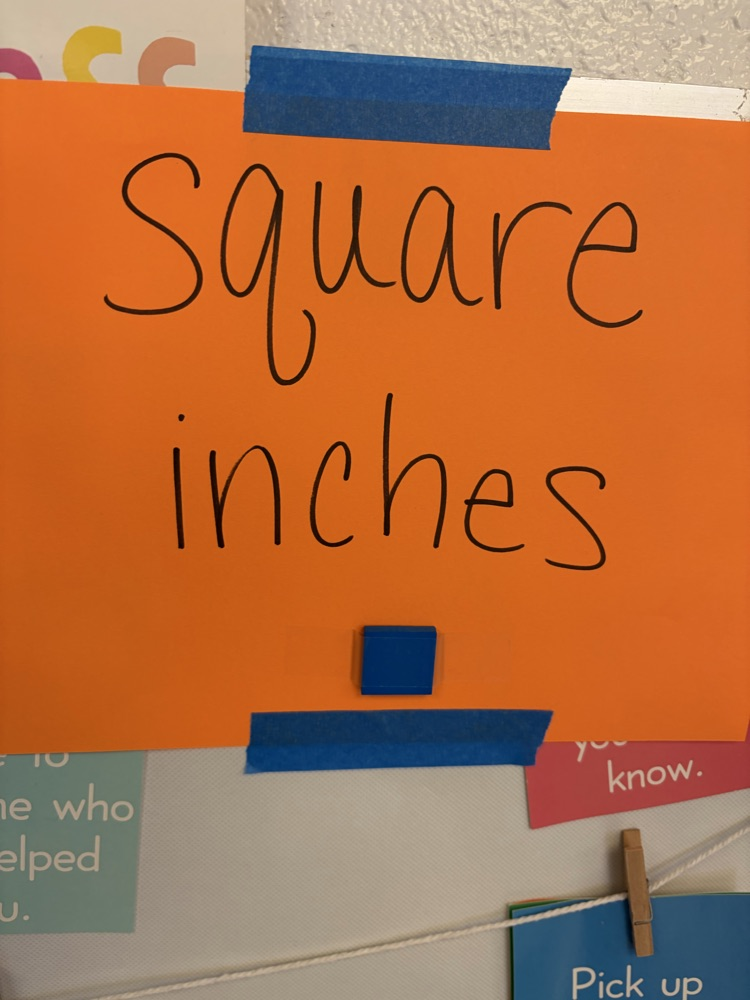 orange sign that reads square inches