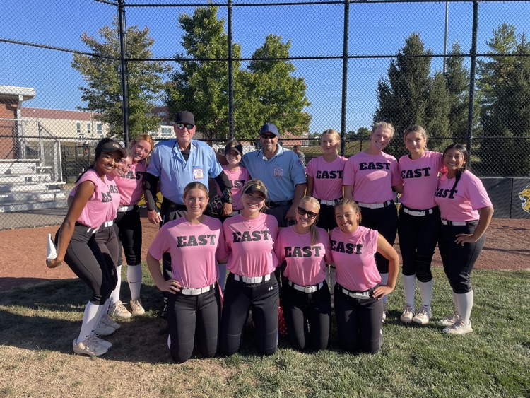 Softball team posing with our umpires