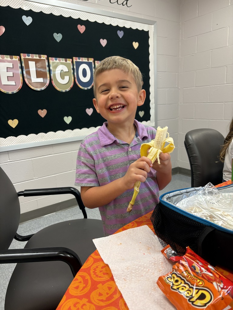 1st grader Desmond smiling at his lunch bunch 