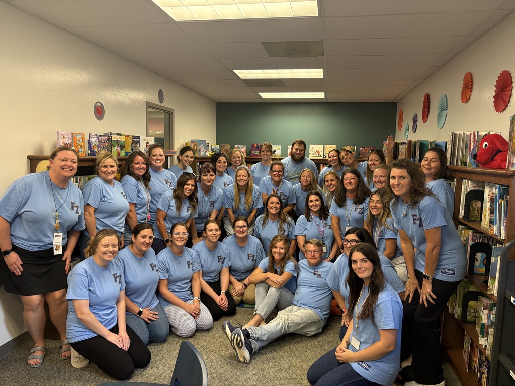 MHE staff in their True Blue shirts to show commitment to Educate, Empower and Equip Students to Excel!