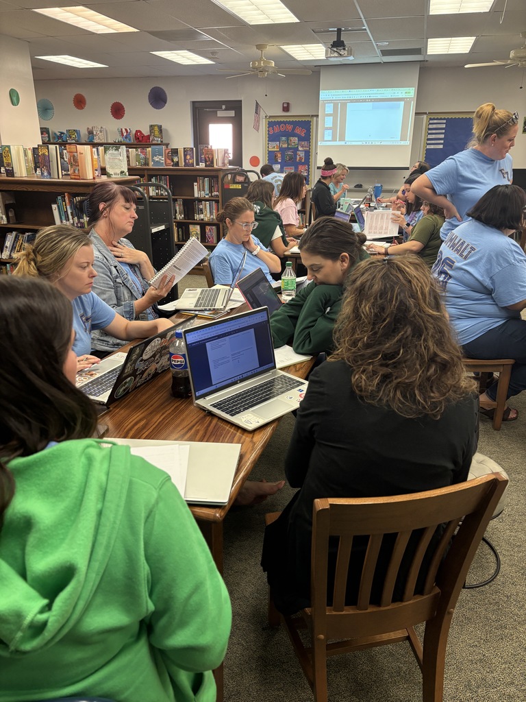 MHE Staff collaborating to learn the new ELA curriculum