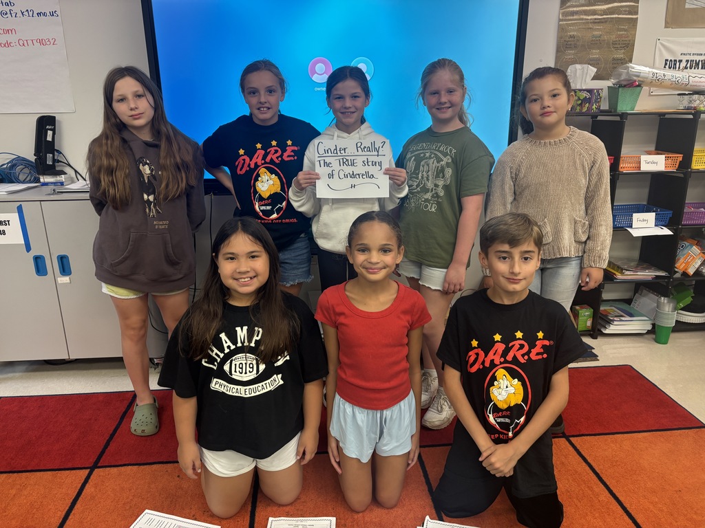 8 4th and 5th graders posing with their drama they will perform Cinder... Really? The TRUE story of Cinderella
