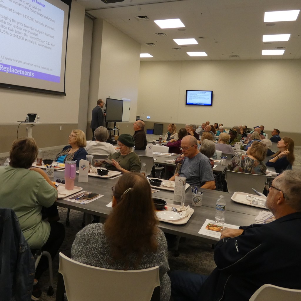 The crowd enjoys lunch as superintendent presents update