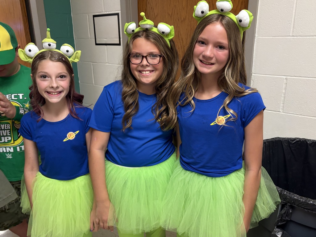 Students dressed up as aliens from Toy Story for the parade 