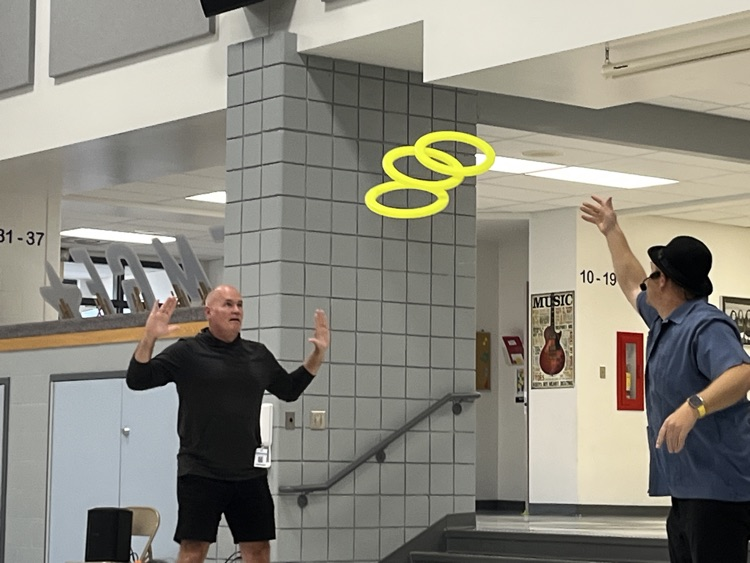 magician juggling with staff volunteer