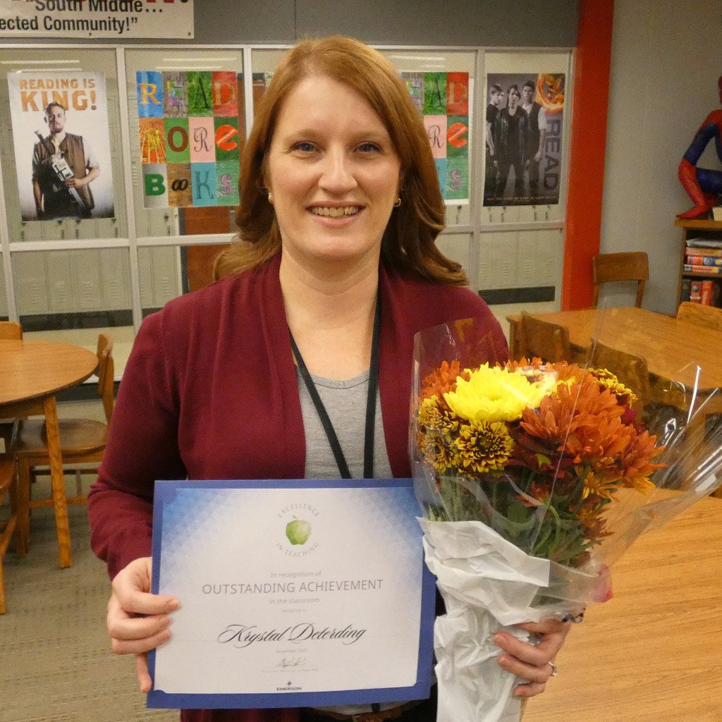 Deterding poses with certificate and flowers