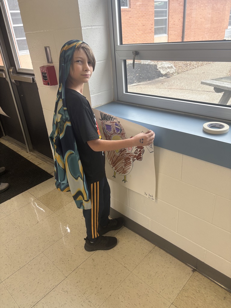 Jack hanging up his turkey poster 