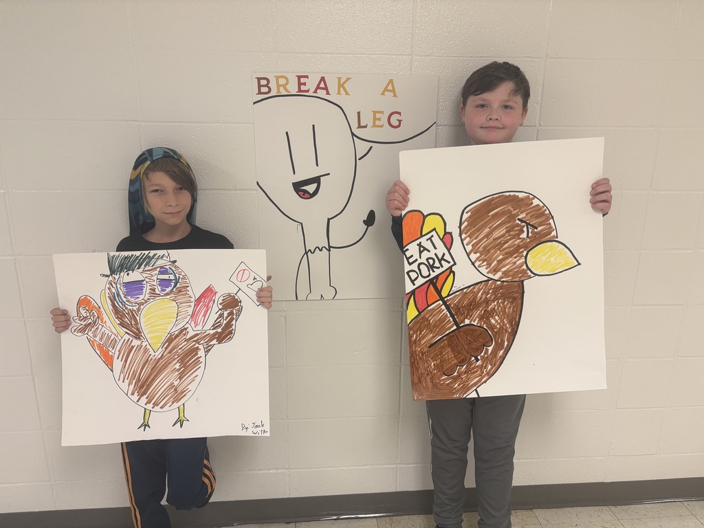 Jack & Archer posing with their turkey posters 