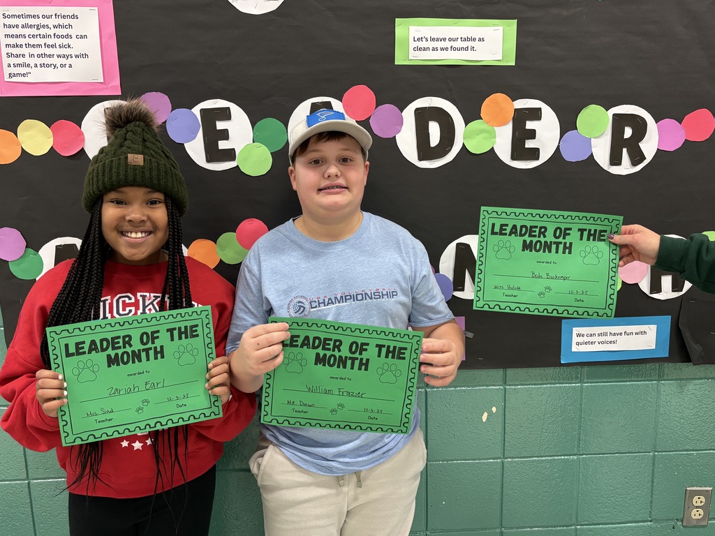 5th grade students with their Leader of the Month Awards