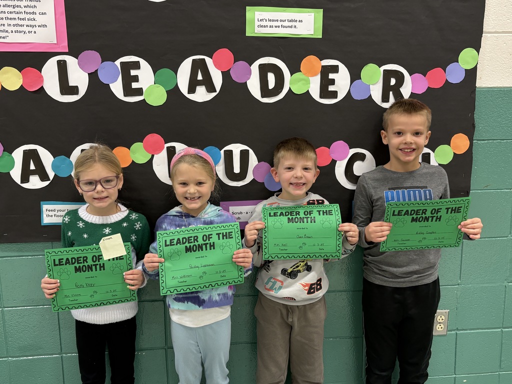 1st-grade students with their Leader of the Month Awards