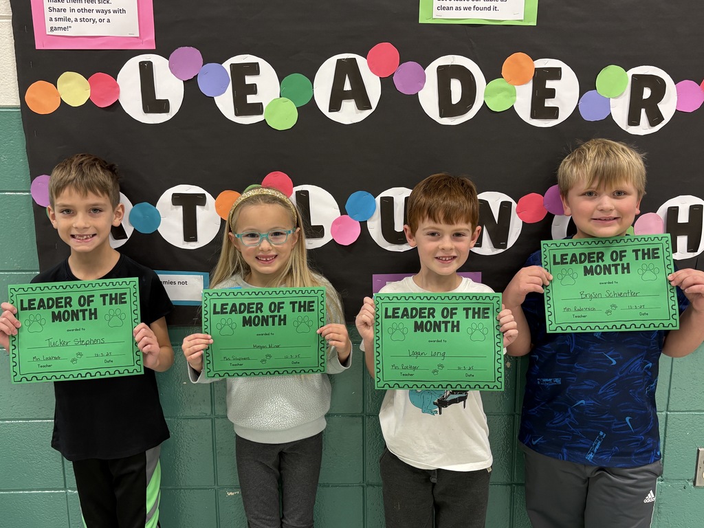 2nd-grade students with their Leader of the Month Awards