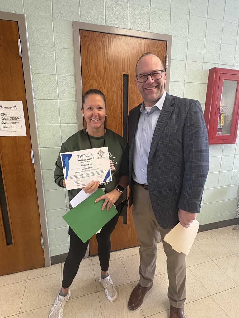 Mrs. Ryan receiving her Triple E Award from Henry St. Pierre