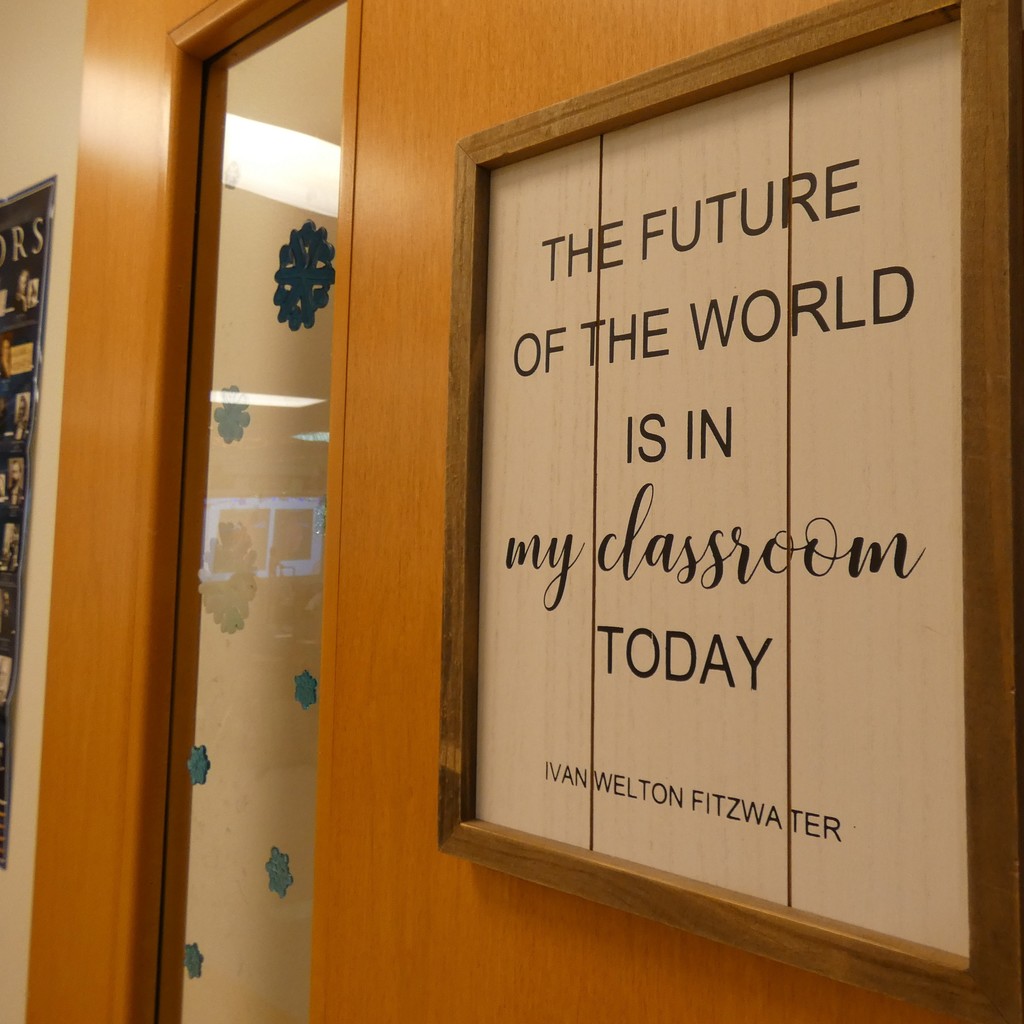 Sign on classroom door welcomes students: The Future of the World is in MY CLASSROOM Today