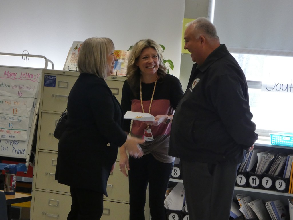 Legislators share a laugh with staff